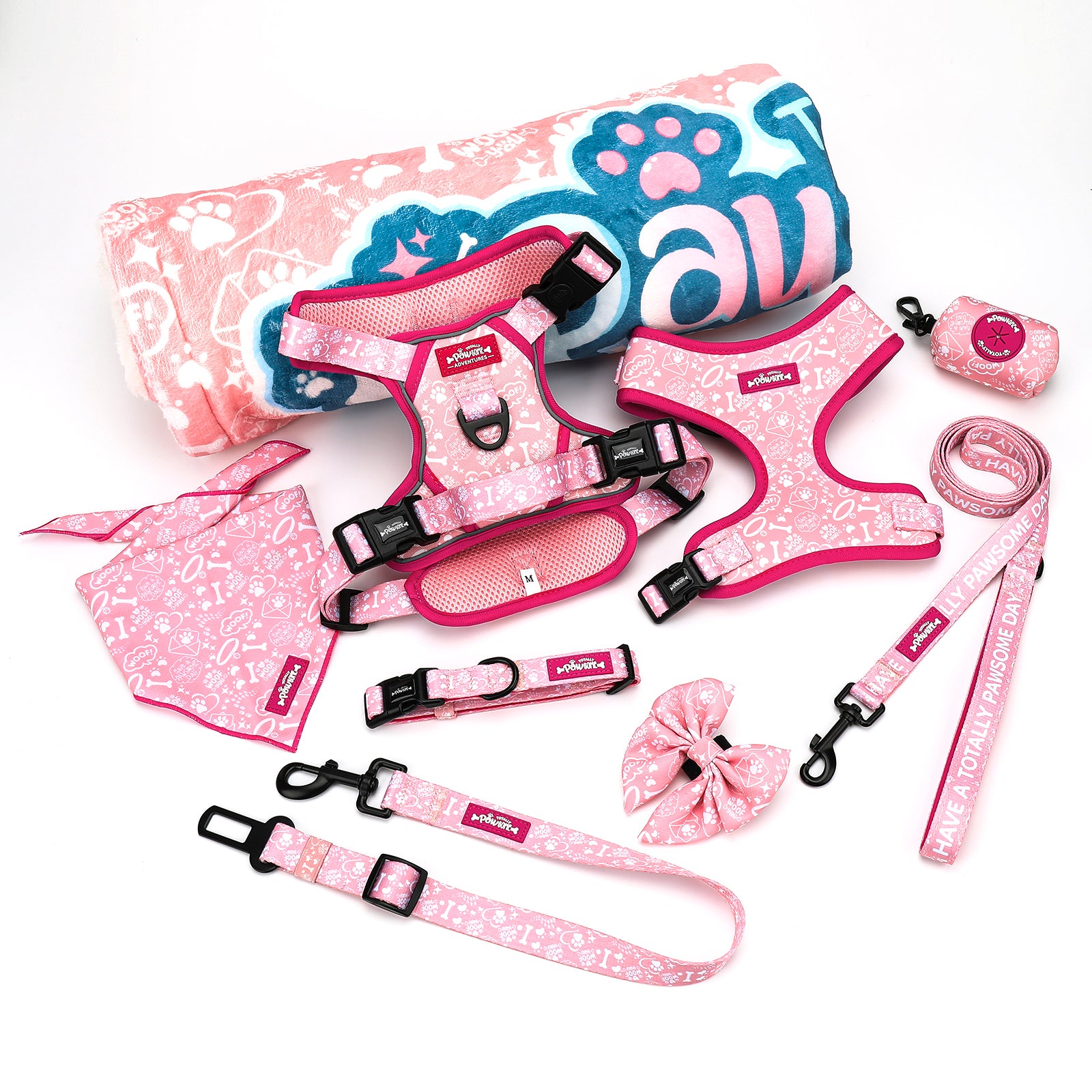 Pink pet accessory set including harnesses, leashes, and a bandana on a white background.