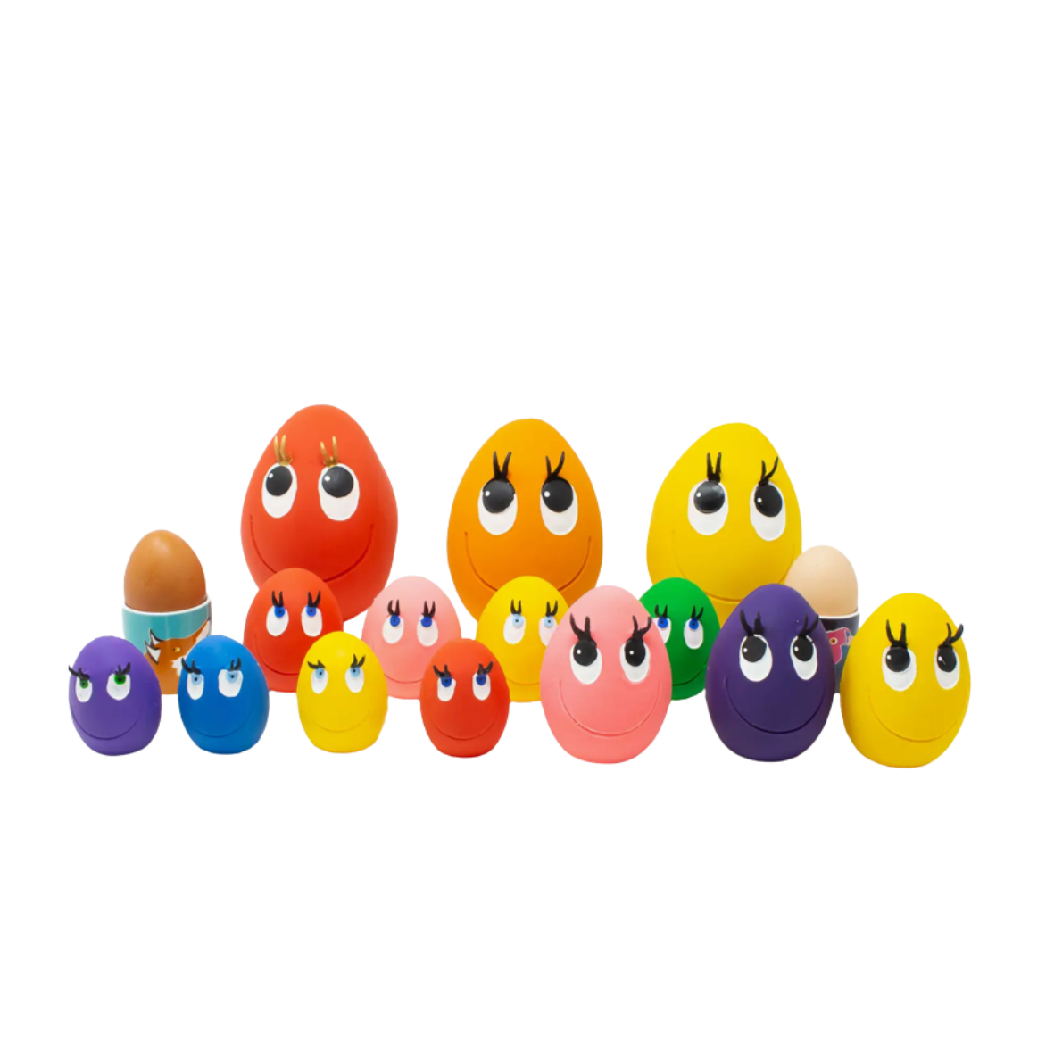 Colorful toy eggs with face designs on a white background