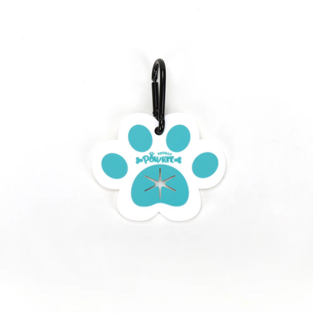A clip designed to hold dog waste bags, featuring a white paw print with blue and black details, attached to a black strap.