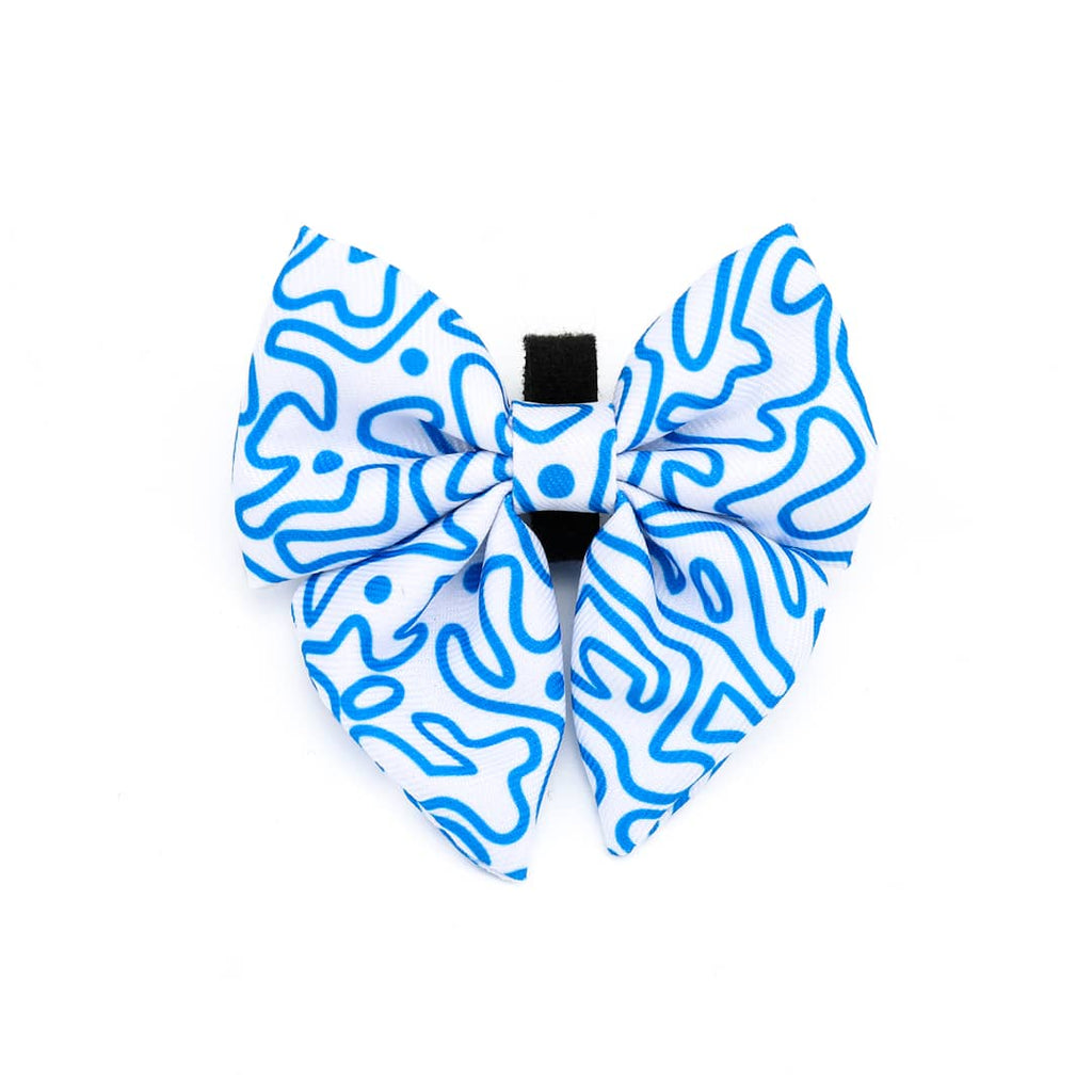 Blue and white patterned bow tie on a white background