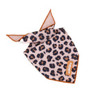 Leopard print bandana with brown trim on a white background