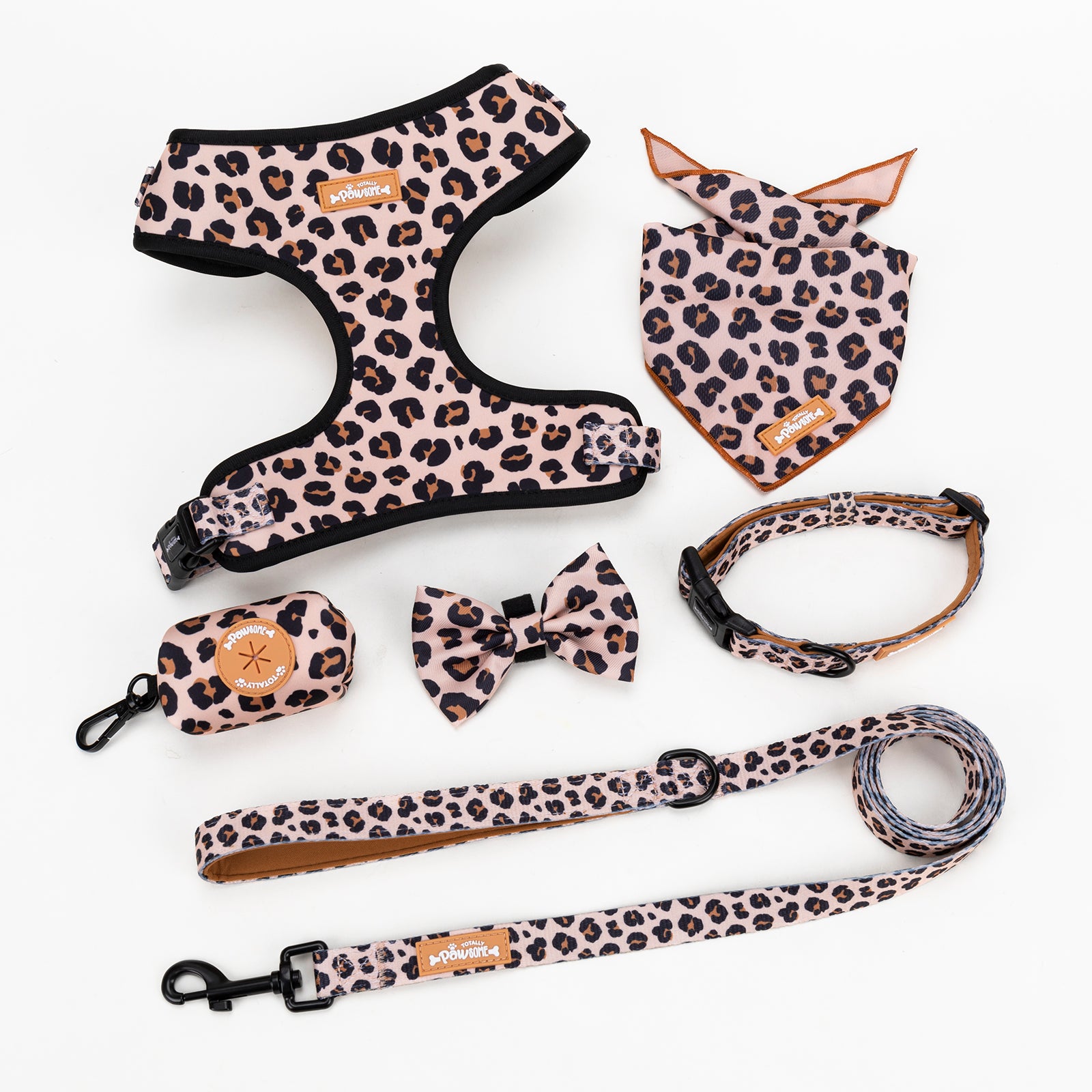 Leopard print pet accessories including a harness, bandana, collar, and leash on a white background.
