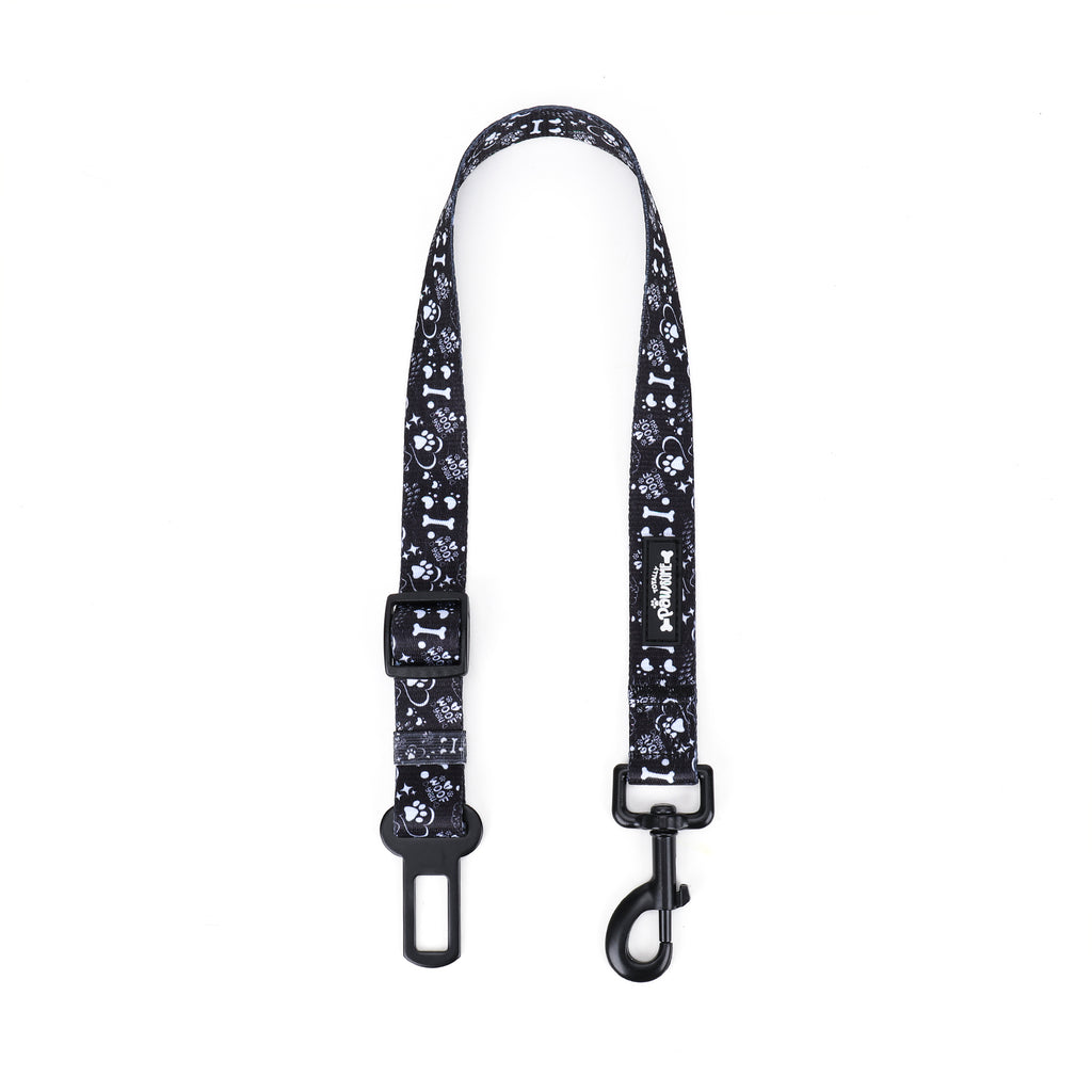 Black and white patterned dog seatbelt on a white background
