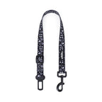 Black and white patterned dog seatbelt on a white background