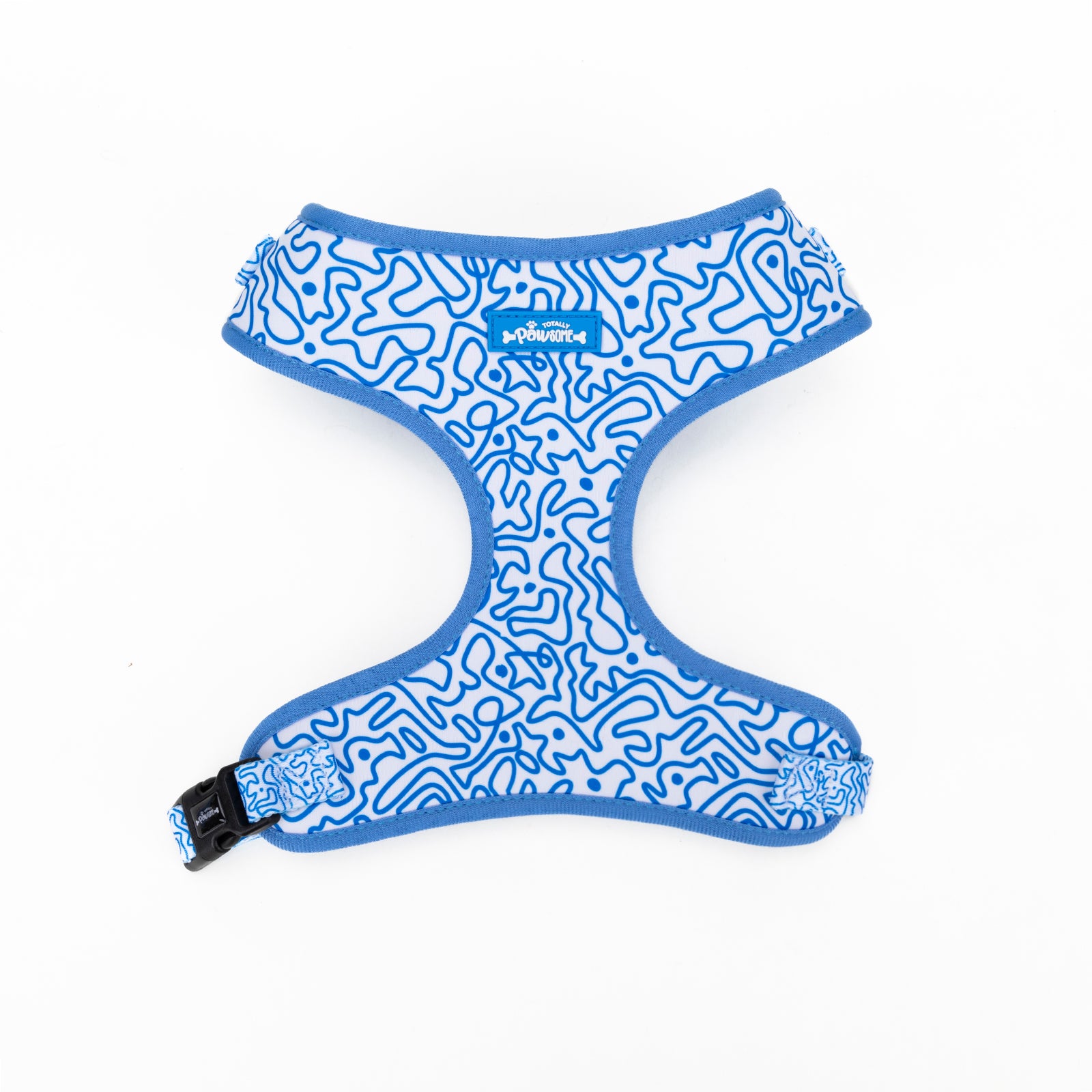 A blue and white swirly patterned dog harness with a black buckle.