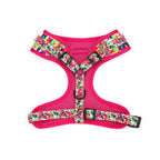 Pink dog harness with colorful geometric pattern on a white background