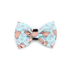 Dog bow tie with teddy bear and flower pattern on a light blue background
