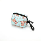 dog poop bag holder with bear pattern on a green background