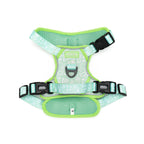 Green dog harness with reflective stripes on a white background