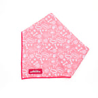 Pink bandana with white paw print pattern on a white background