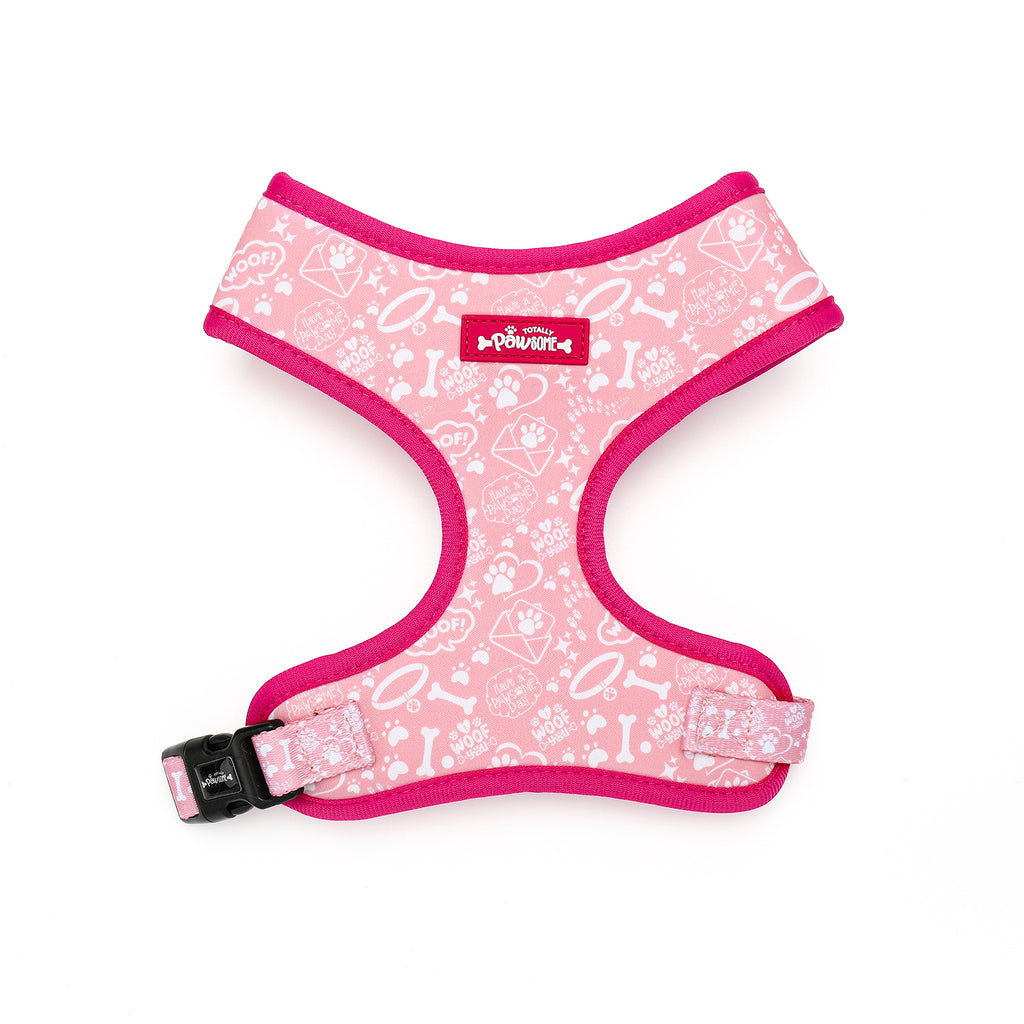Pink dog harness with white patterns on a white background