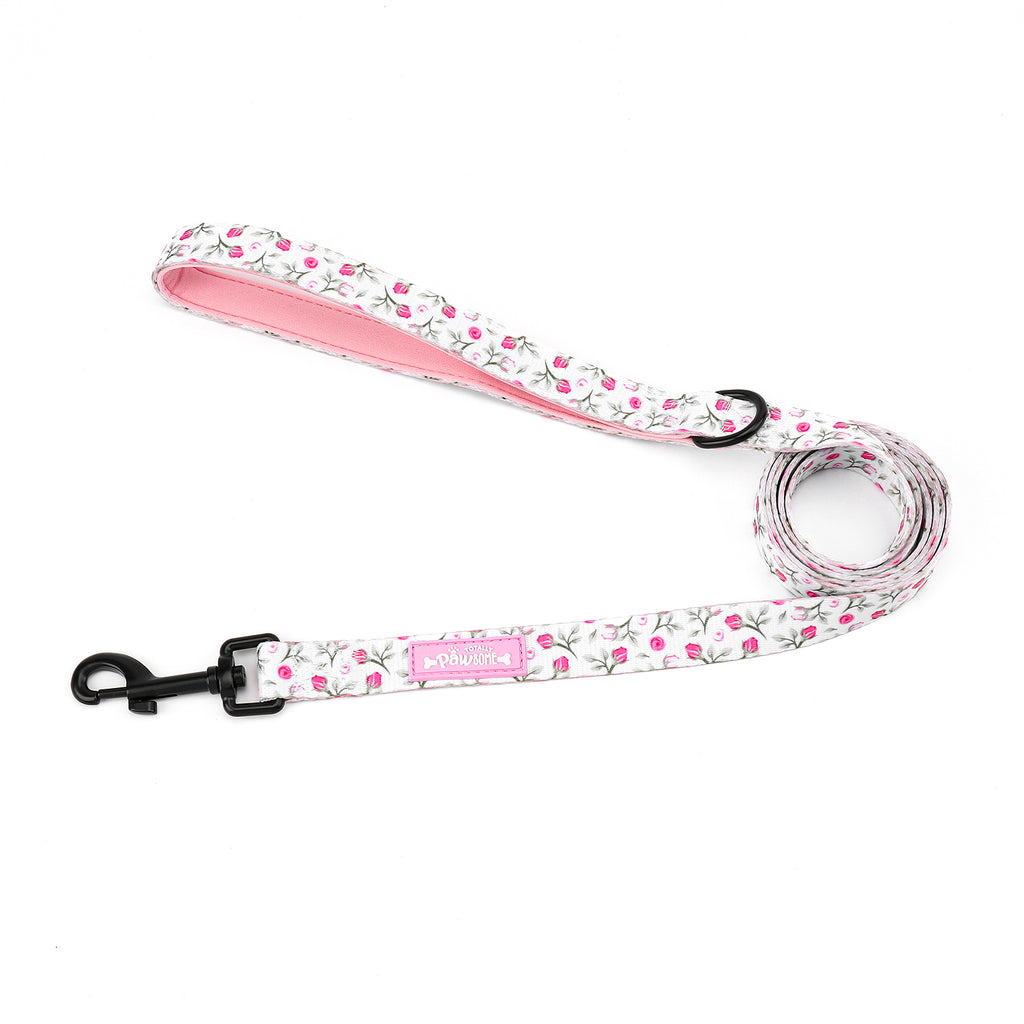 Floral patterned dog leash with pink handle on a white background