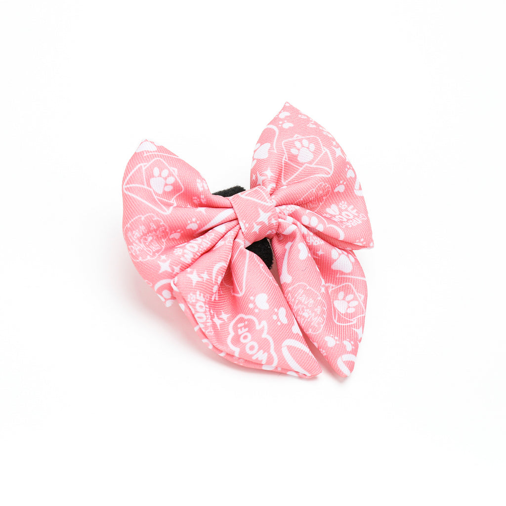 Pink bow with white patterns on a white background