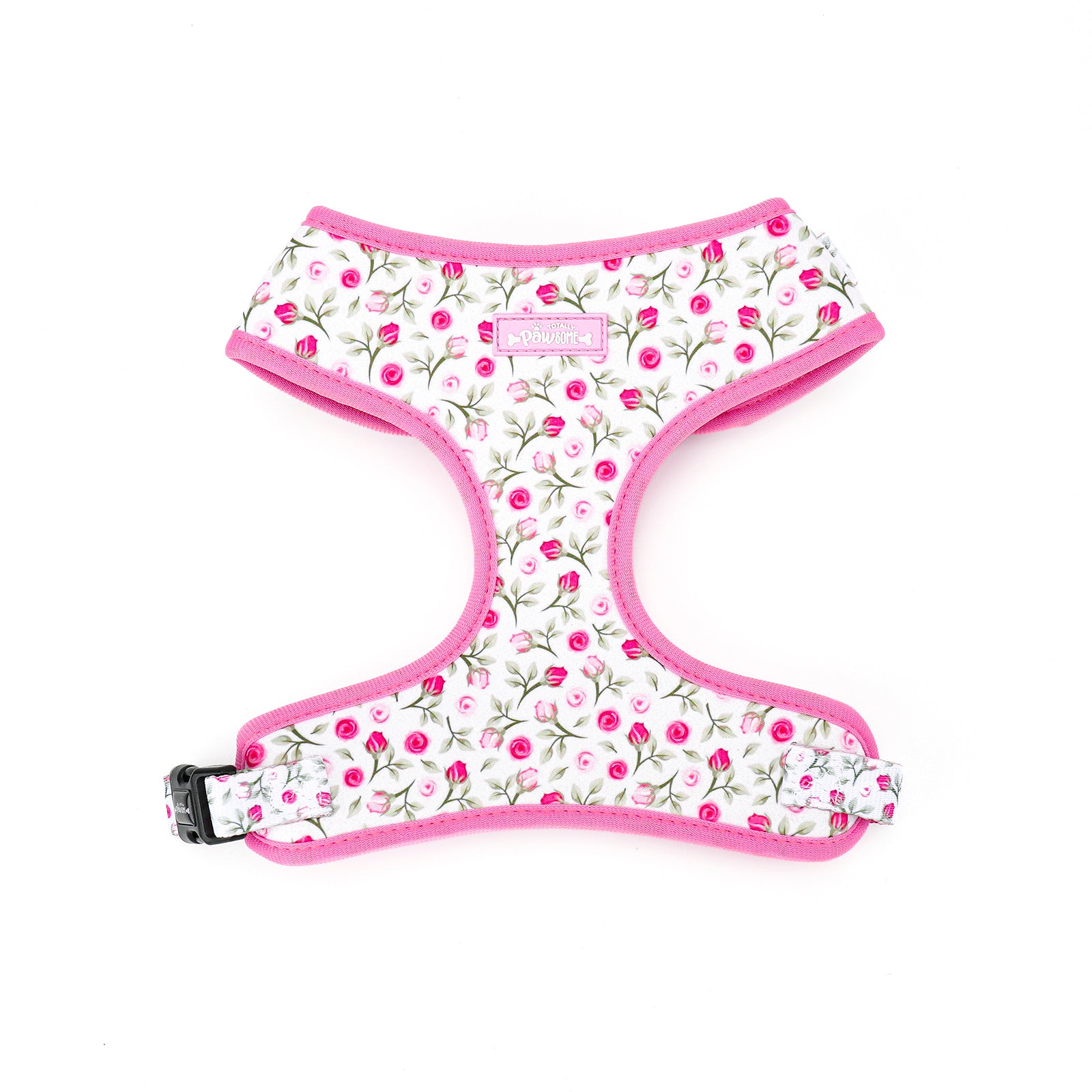 Floral patterned dog harness with pink trim on a white background