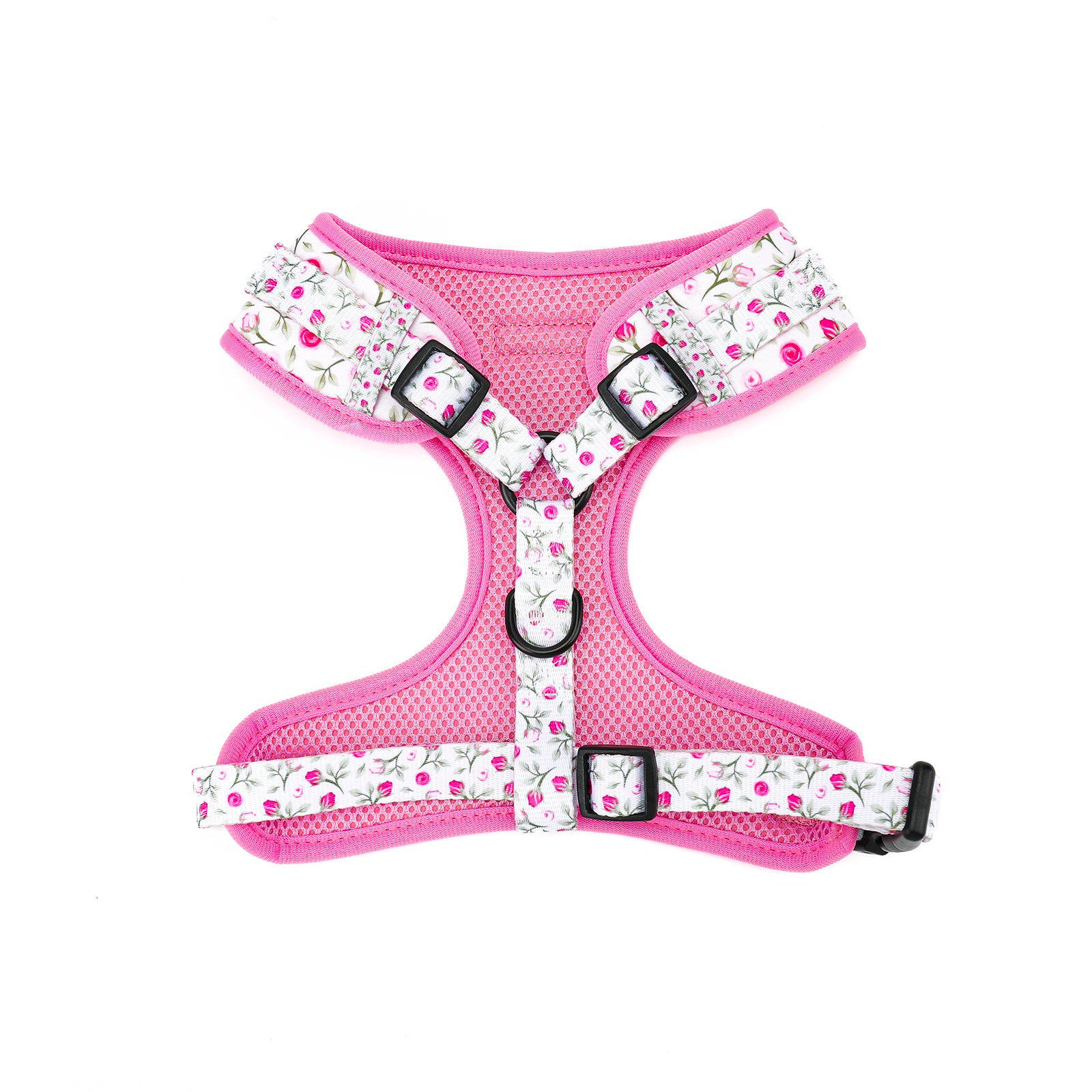 Pink dog harness with floral pattern on a white background
