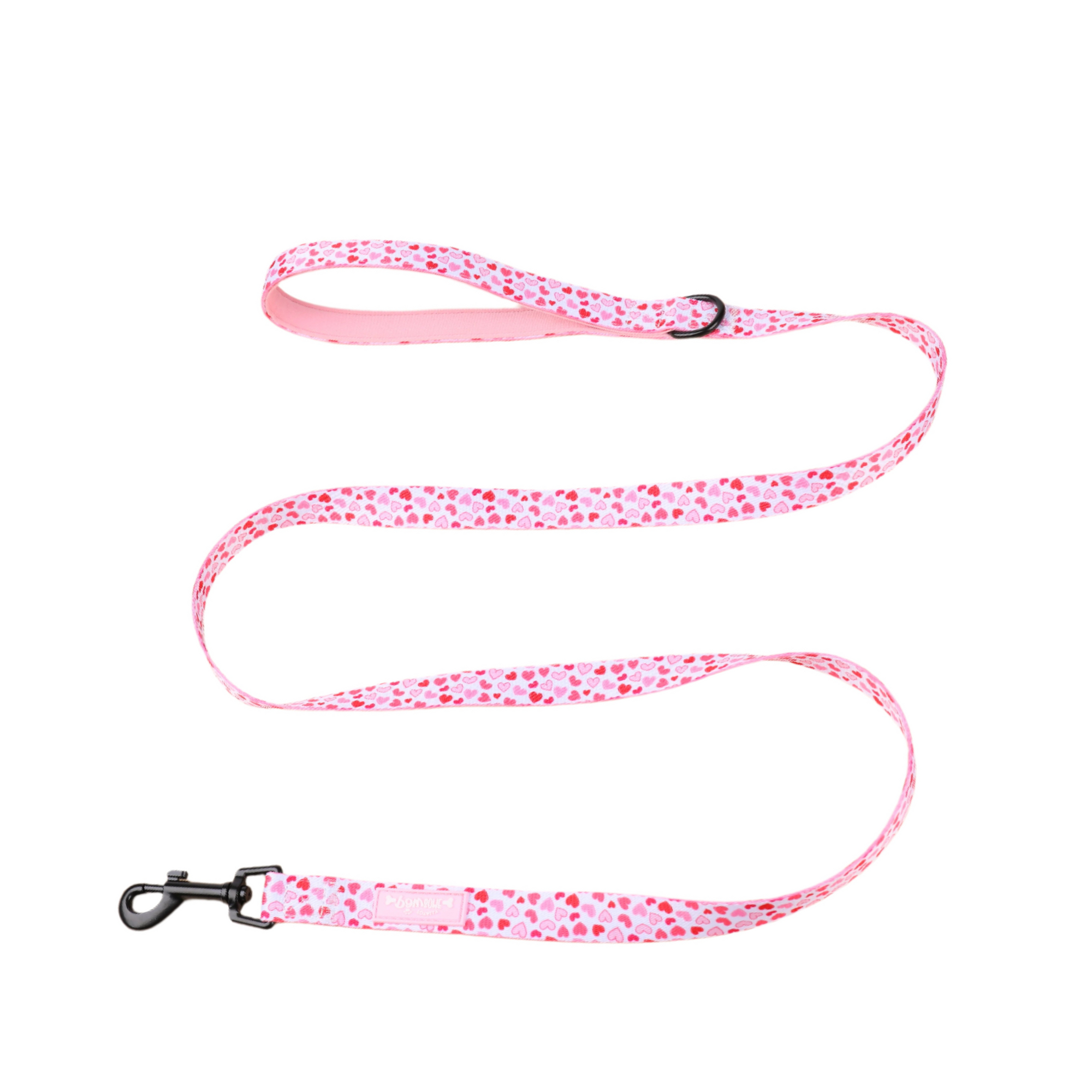 Pink dog leash with red heart pattern on a white background