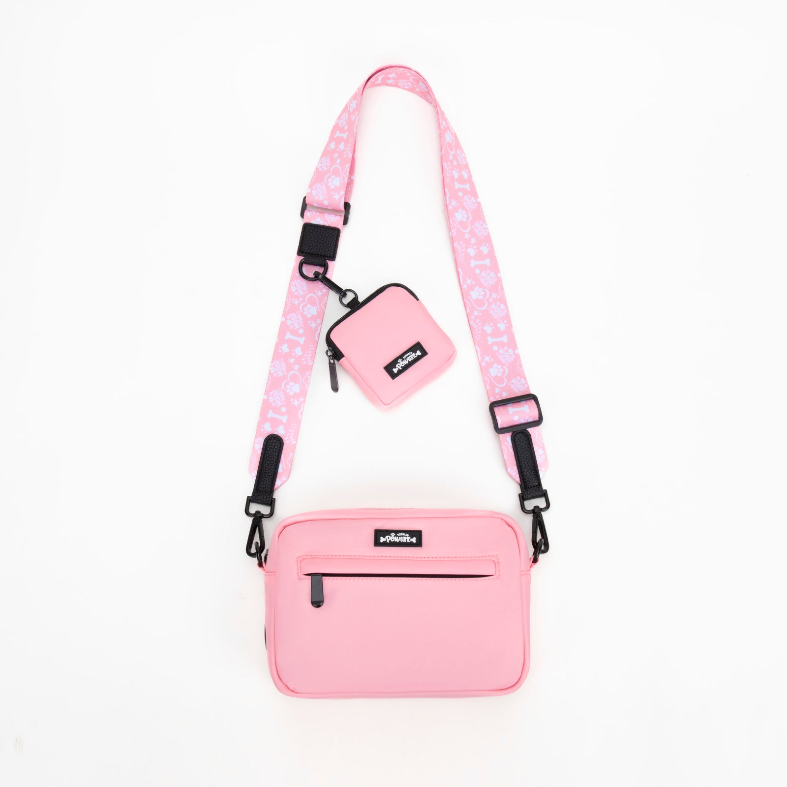 Pink crossbody bag with a matching pouch on a white background