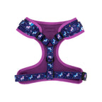 Purple dog harness with unicorn pattern on a white background