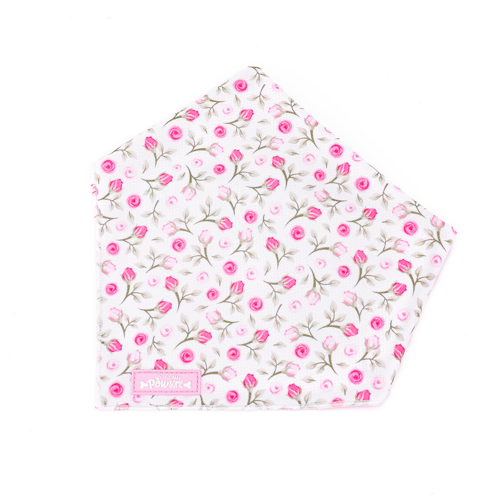 Floral-patterned dog bandana with a visible brand logo on a white background