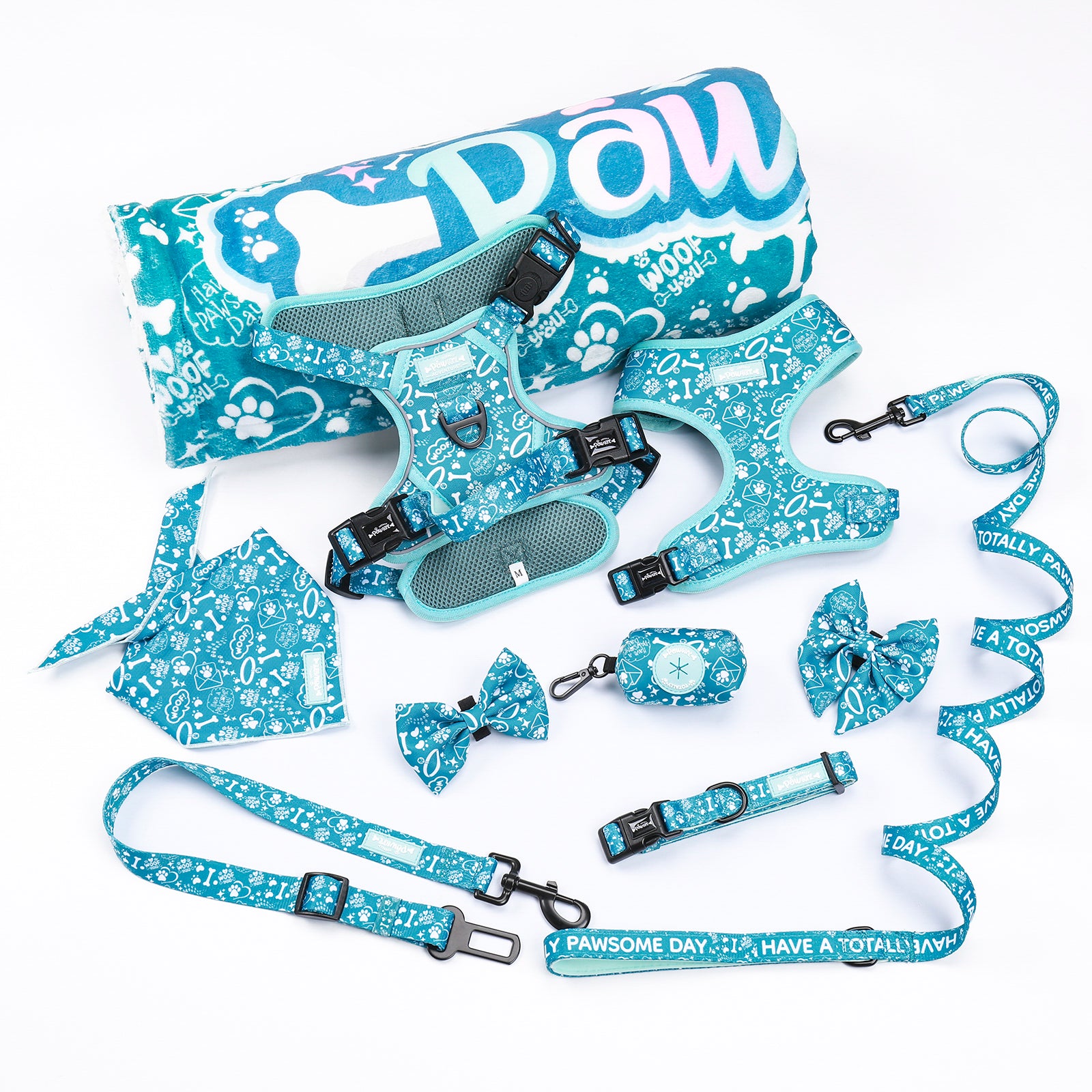 A collection of pet apparel and accessories with a teal and multicolored pattern, including a blanket, harness, bowties, and a leash.