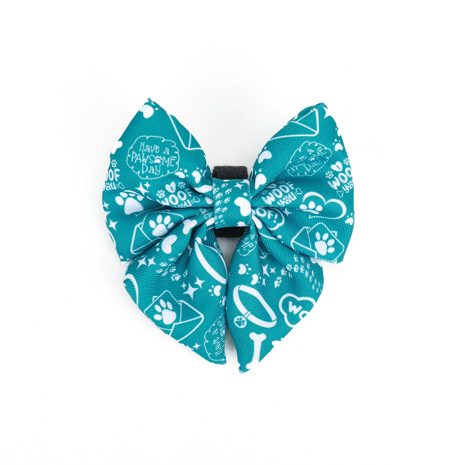A teal dog sailor bowtie with a pattern of paws and adventure-themed graphics.