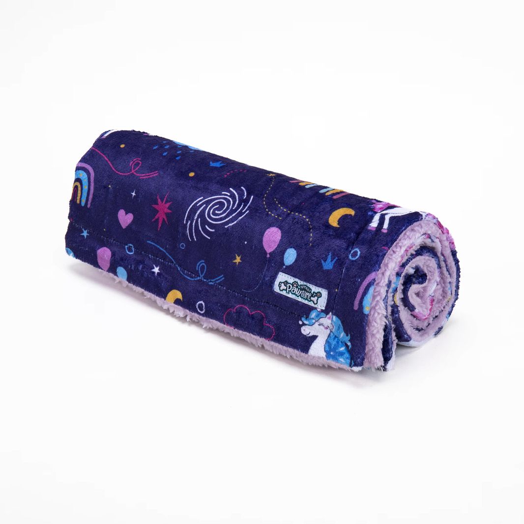blanket rolled with unicorn pattern on a white background