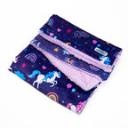 dog blanket with unicorn and rainbow patterns on a white background