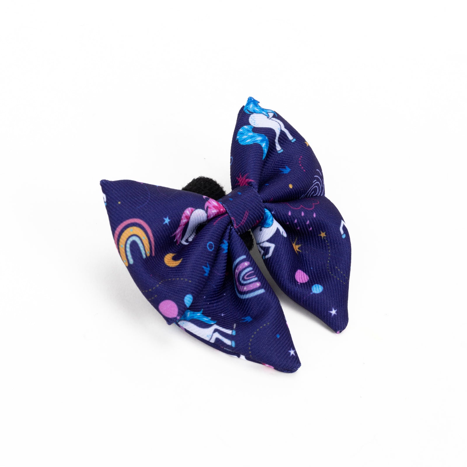 purple dog bow tie with unicorn and rainbow patterns on a white background